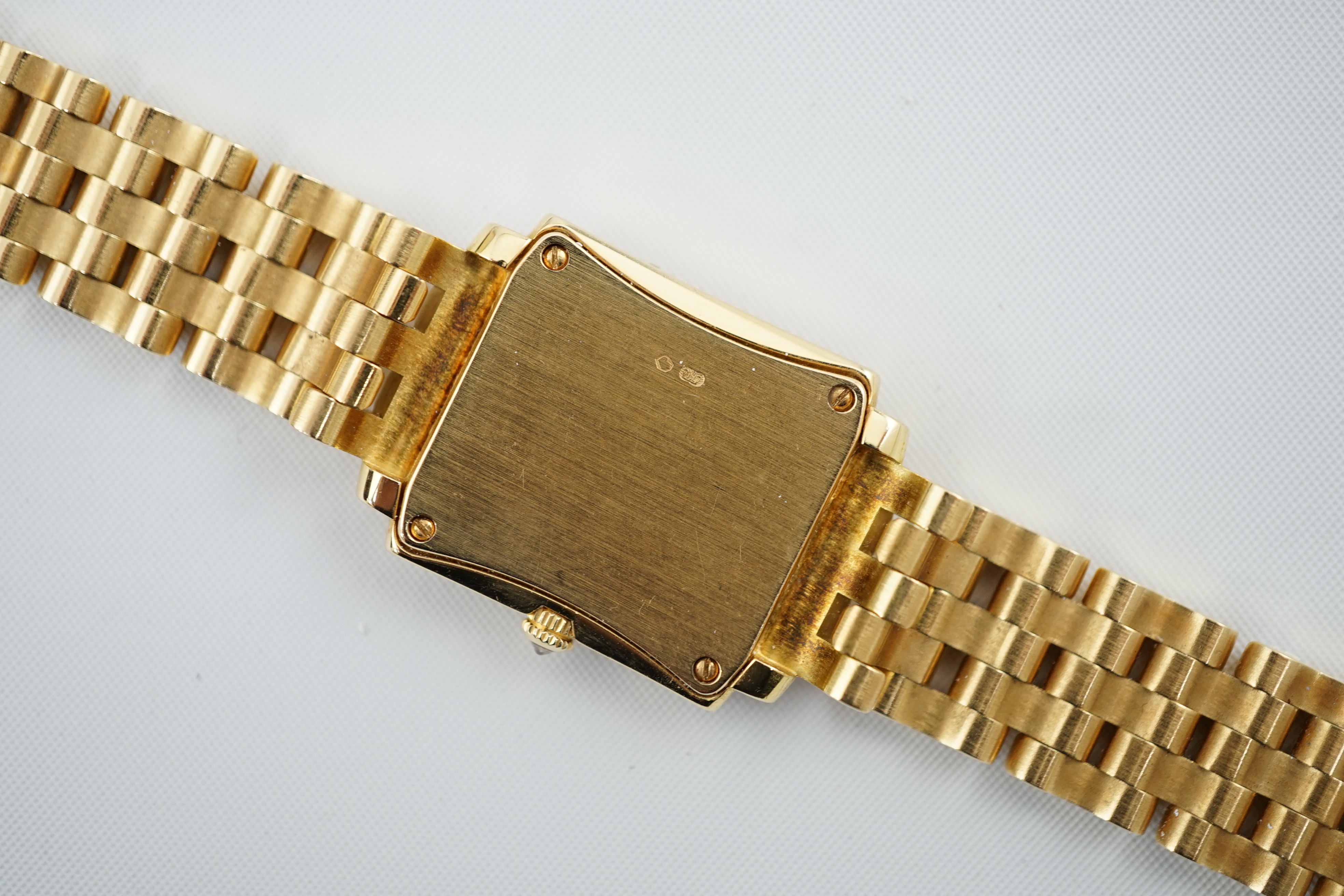 A lady's late 1990's 18ct gold and diamond set Patek Philippe Gondolo quartz wrist watch, on an 18ct gold Patek Philippe bracelet